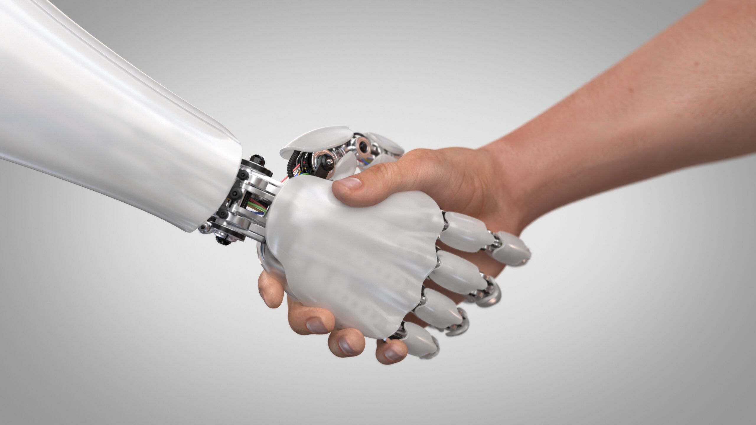 Roboter gibt Mensch die Hand © lexaarts iStock Getty Images Plus