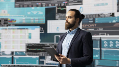 Surrounded by fintech data and forecasting models, entrepreneur analyzes data and insight to drive business growth. Company performance and smart decision making through innovation. ©Dragos Condrea iStock Getty Images Plus