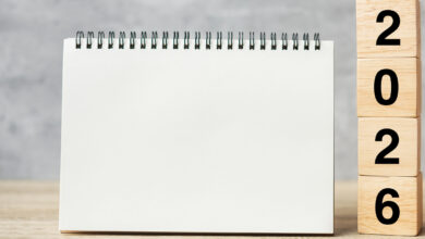 2026 Happy New Year with blank notebook and wooden number. countdown, Resolution, Goals, Plan, Action and Mission Concept