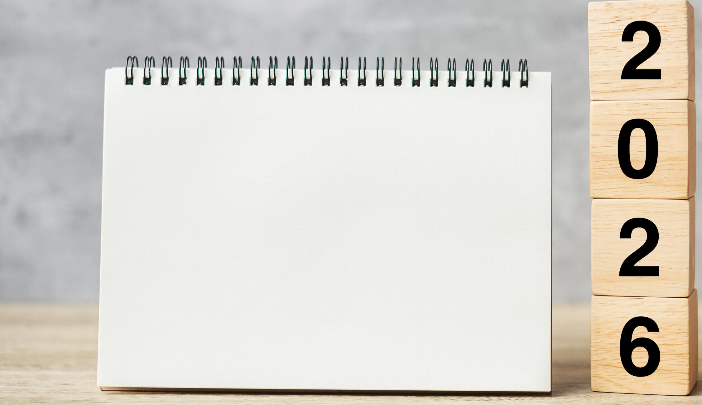 2026 Happy New Year with blank notebook and wooden number. countdown, Resolution, Goals, Plan, Action and Mission Concept